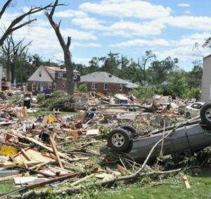 Storm damage restoration crew repairing water damage after heavy rain and flooding