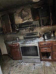 Kitchen fire damage with smoke staining and suppression water in Layton UT