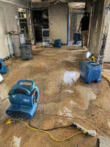 Water damage restoration equipment in fire damaged Layton UT home