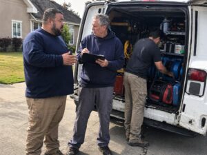 Upkeep Water Damage Restoration team in front of work van in Layton UT