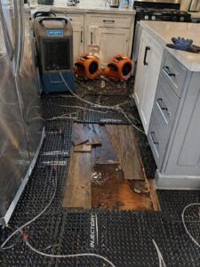 Floor mat drying system on kitchen LVP flooring in Layton UT